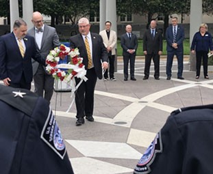 On October 12, 2021, NTEU honored Customs and Border Protection Officers who lost their lives in the line of duty by laying wreaths at the National Law Enforcement Officers Memorial in Washington, D.C. Pictured left are (l. to r.) Chapter 128 (CBP HQ) Vice President Robert Odom, National Executive Vice President Jim Bailey and National President Tony Reardon.